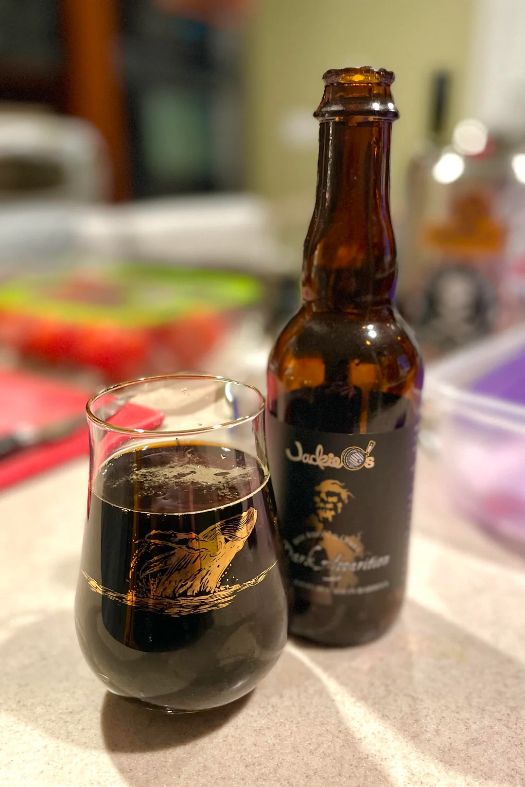 Bourbon Barrel Dark Apparition glass with a layer of dark, delicious powder reflecting on the twin black beer surface - Bourbon Barrel Dark Apparition: The Art of Bourbon and Stout