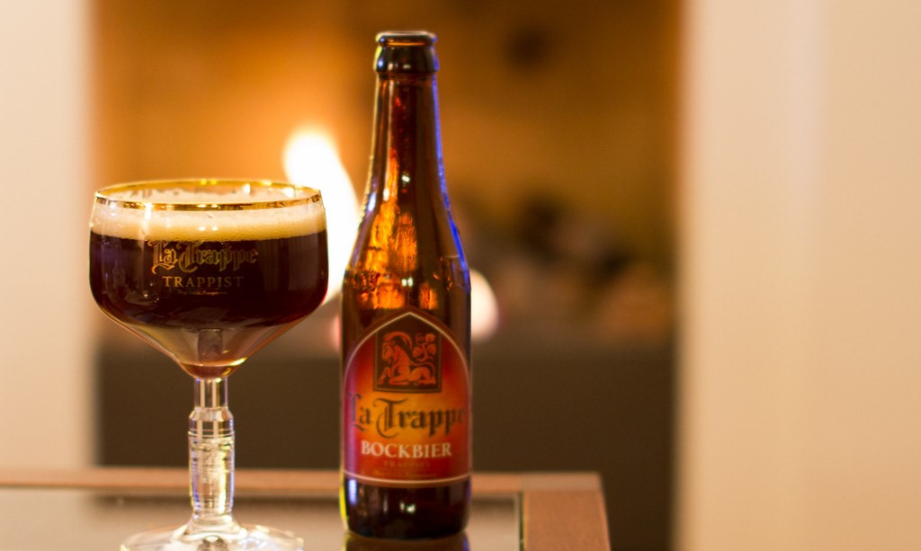 The La Trappe Bockbier bottle stands out with its ruby brown color and classic Trappist label.