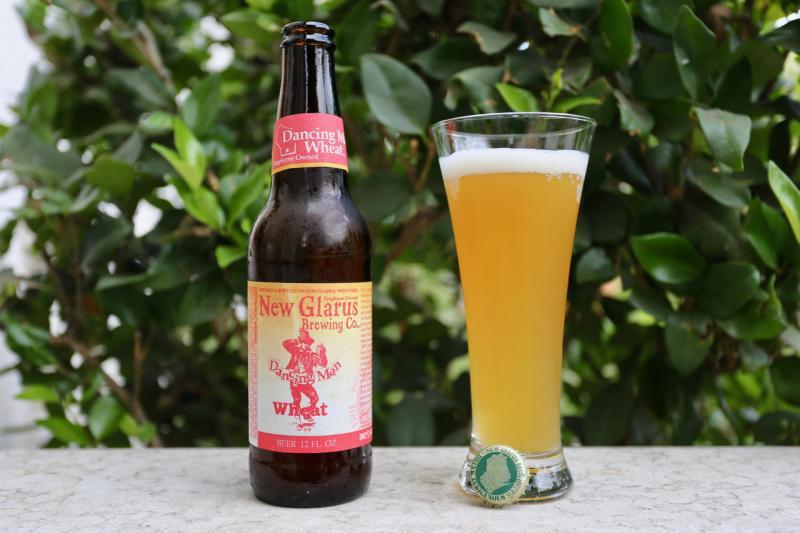 Dancing Man beer bottle with distinctive opaque gold color and classic label