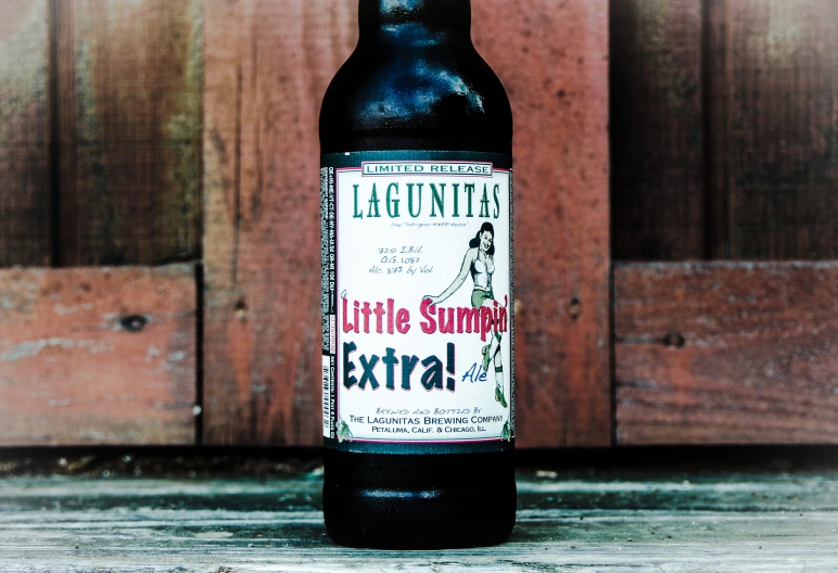 The beer bottle features a white label and Lagunitas logo, artisan style.