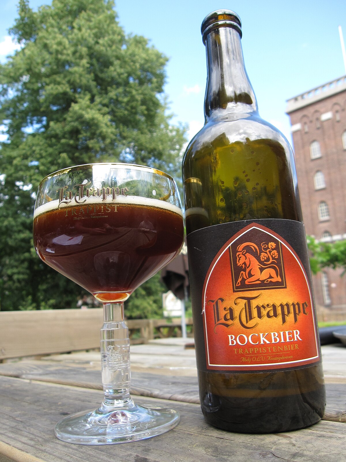 A glass of Bockbier with a ruby brown color, an attractive layer of powder and a warm autumn light - La Trappe Bockbier: A Journey From Koningshoeven Abbey