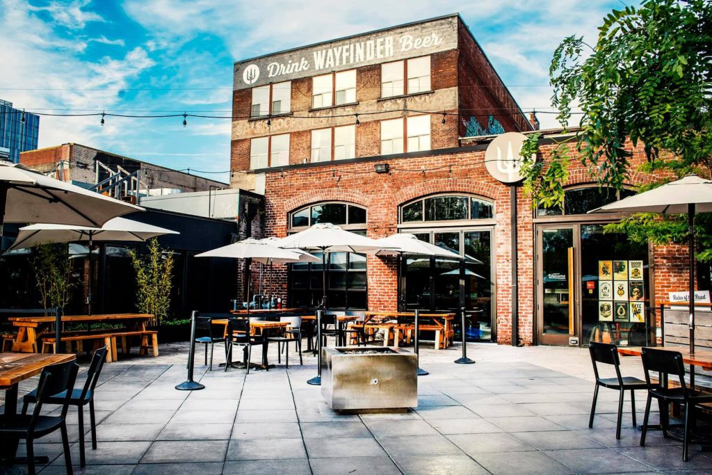 A panoramic view of the Wayfinder craft brewery in Portland, Oregon - Terrifica: A glass of beer carrying the clear taste of sunshine.