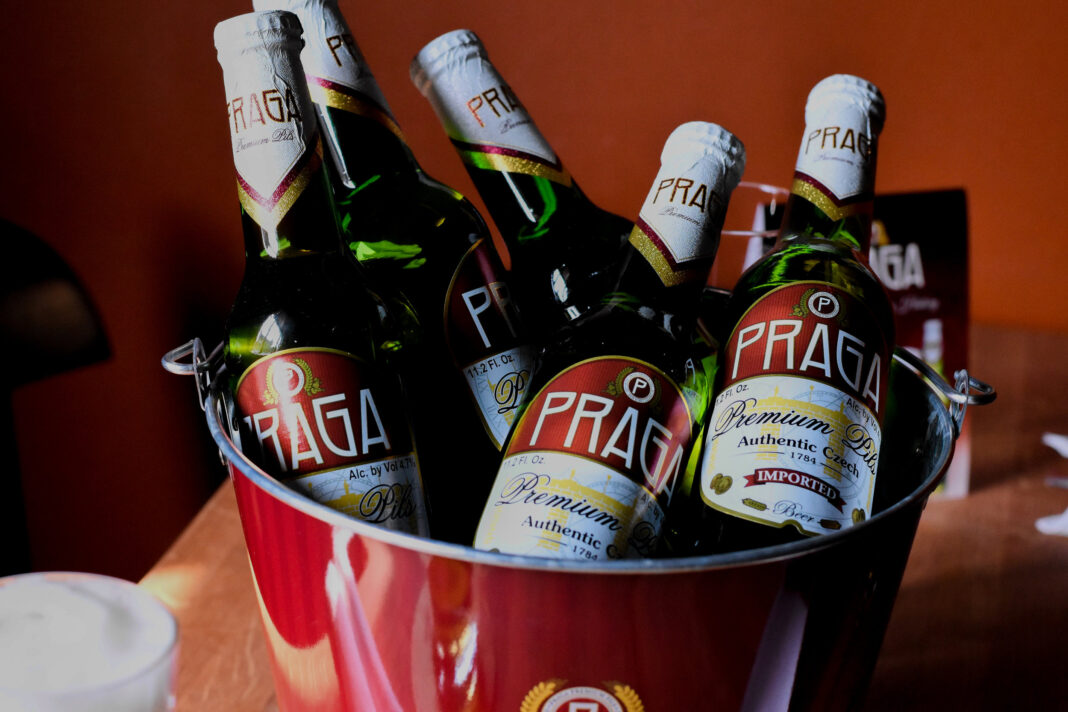 Praga Dark Lager beer bottle, with a characteristic dark color.