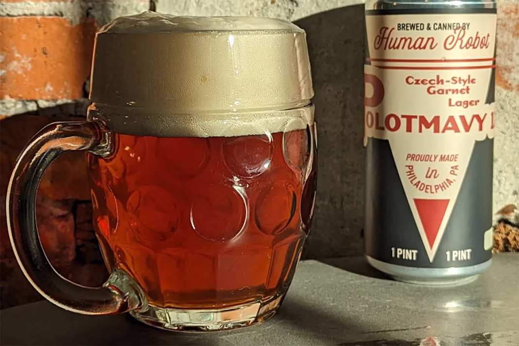 Image of the Polotmavy 12° bottle from Human Robot Brewery, featuring a deep red color and simple, elegant design.