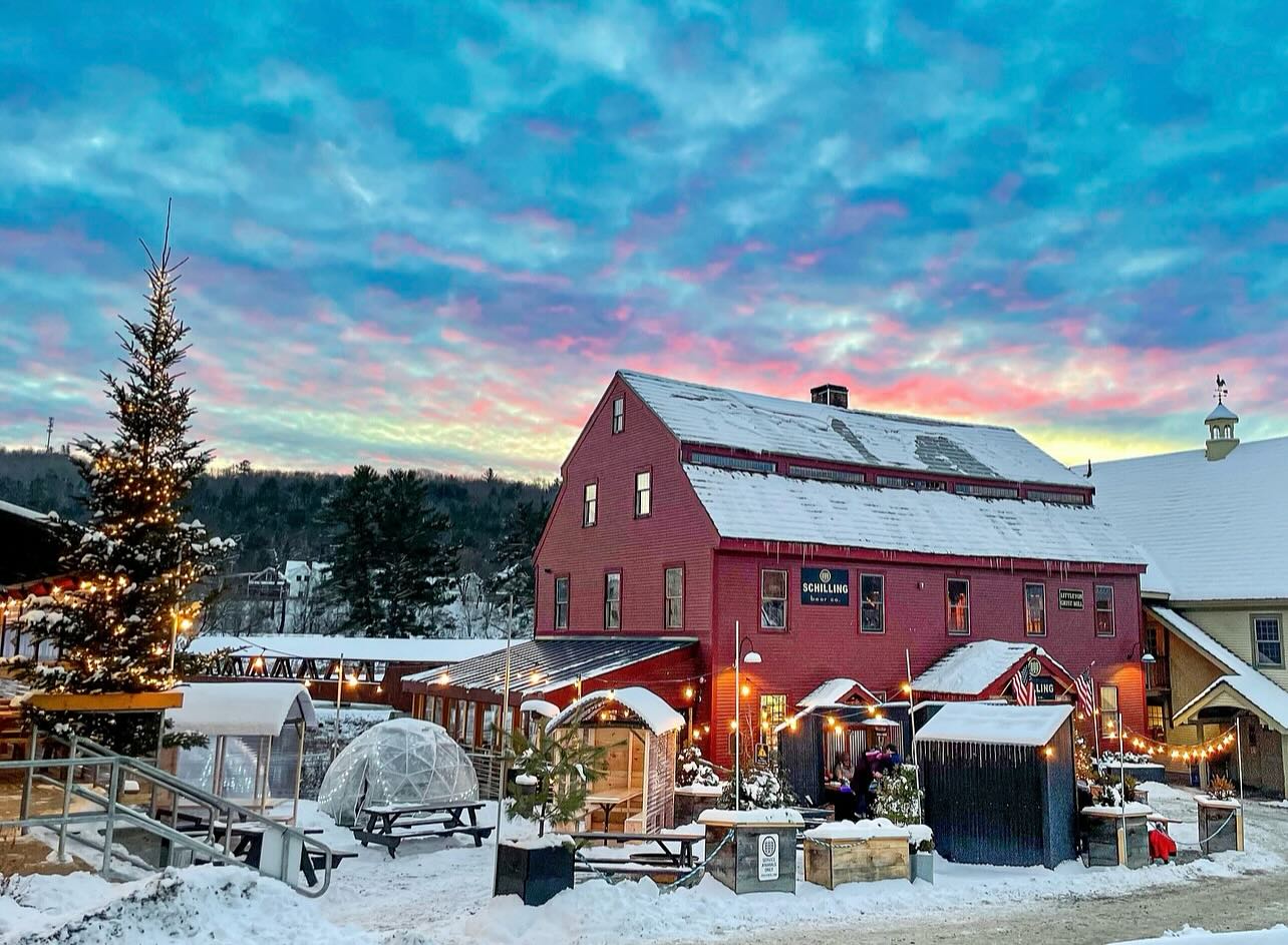 Schilling Beer Co. Brewery, with its classic wooden architecture, sits on the riverbank in Littleton, NH - Aosta: The Alpine Melody in Every Drop of Pure Lager