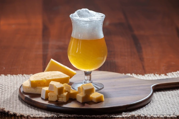 Ayinger Weizenbock: Every Sip of Beer, Every Memory of a Lasting Love glass belgian light blonde beer 600nw 2285107965 - Ayinger Weizenbock: Every Sip of Beer, Every Memory of a Lasting Love