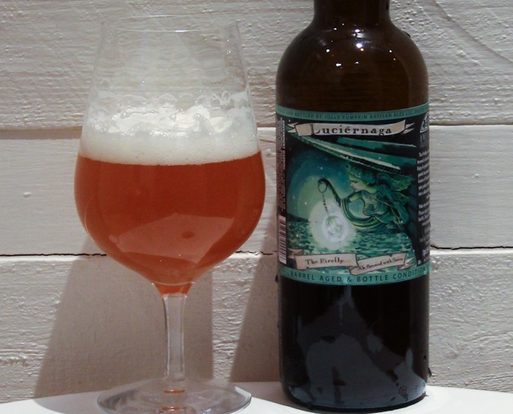 Beer with a golden hue like sunlight shining through the Michigan forest - Luciérnaga: Firefly Light Captivates Beer Connoisseurs