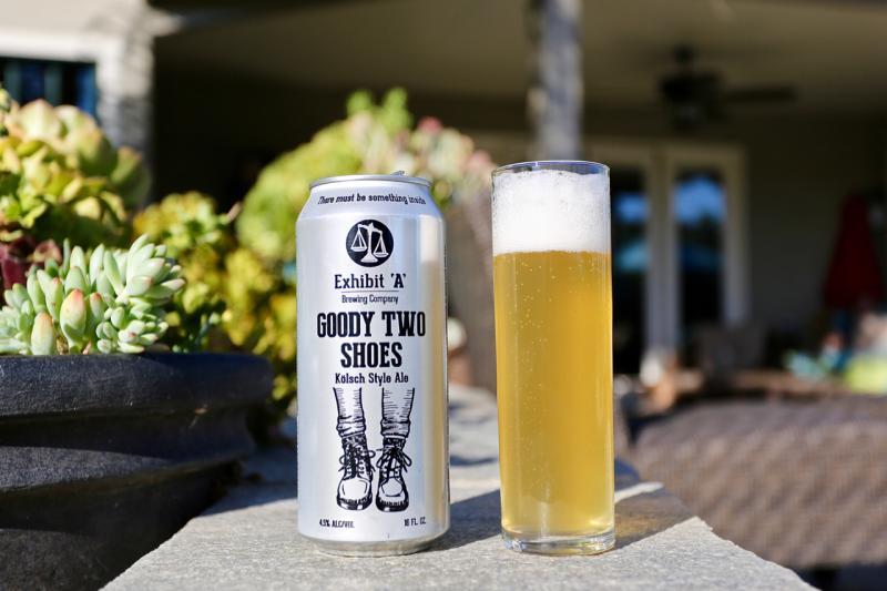 Goody Two Shoes has a unique beer can design with a foot wearing shoes - Goody Two Shoes: Dewdrops on Beer Petals
