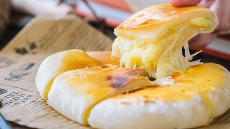 The rich, creamy mozzarella cheese goes perfectly with the flavor of this beer - Lucky Buddha Enlightened Beer: Golden Rice For A Happy Soul