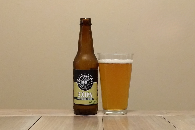 2XIPA beer bottle on wooden table 2XIPA beer bottle on wooden table