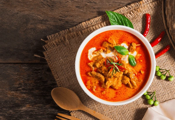 Devil Dancer: The Fierce Dance of Legendary Beer top view panang curry pork 600nw 2447691809 - Devil Dancer: The Fierce Dance of Legendary Beer