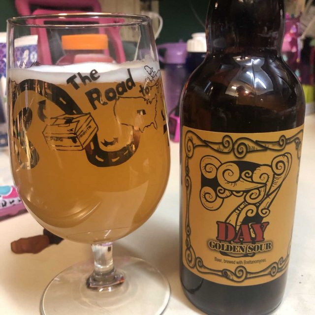 7 Day Golden Sour has an impressive beer bottle design with the number 7 in art - 7 Day Golden Sour: Welcome the Dawn with Golden Sunshine