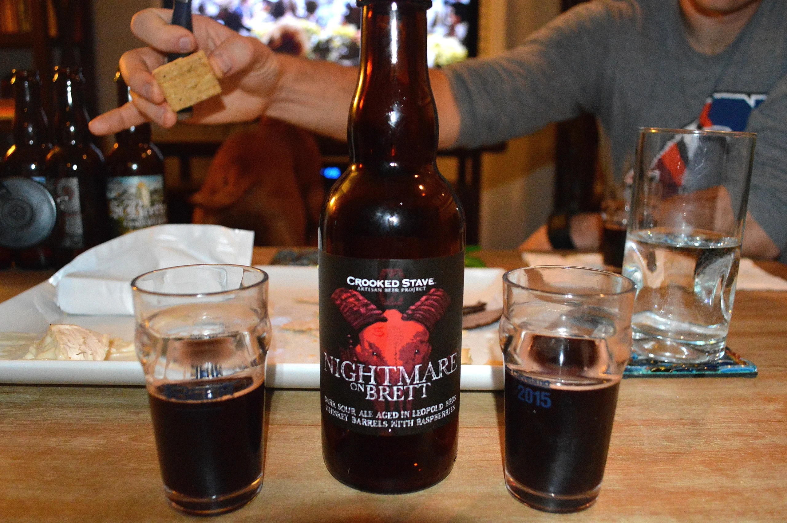 Ruby-red beer reminiscent of rubies set in scaled white - Nightmare On Brett Raspberry: Drunken Love Variations
