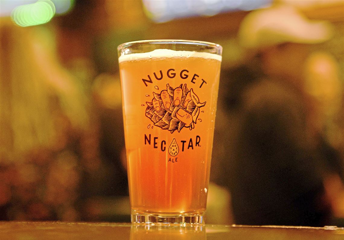 Double Nugget Nectar: Immerse Yourself in Red Heritage - A sparkling amber beer like a sunset or a warm copper coin