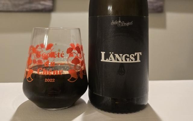 The beer has a brown color to slowly warm the dark horizon like a starless autumn night - Langst: The Passionate Breath of Dreams Encased in Wood