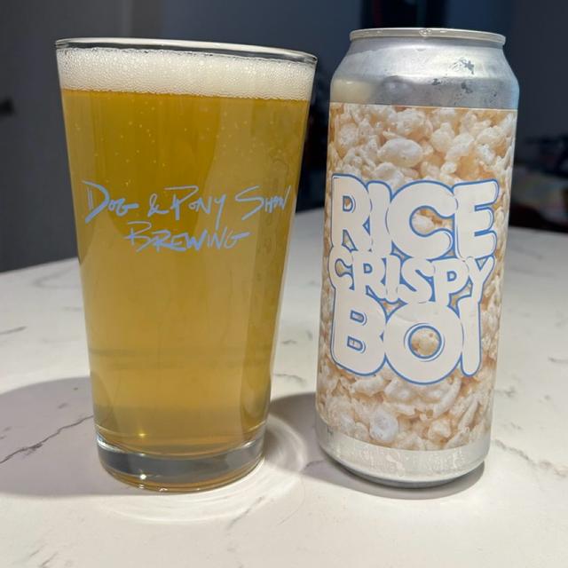 The beer has a light golden color, reflecting a pure golden hue under the light - Rice Crispy Boi: The Flavor of a Heart Craving Purity