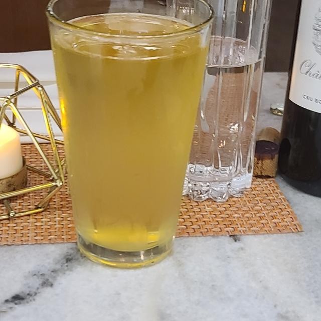 The beer has a pale golden color, sparkling and transparent to the point that you can see through it - Ukiyo: The Crystallization of Rice Yeast and Silence