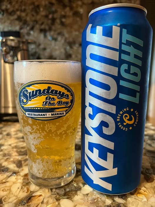 The beer has a light golden color, like the concentrated morning sunlight - Keystone Light: Dance of the Mountains and Forests