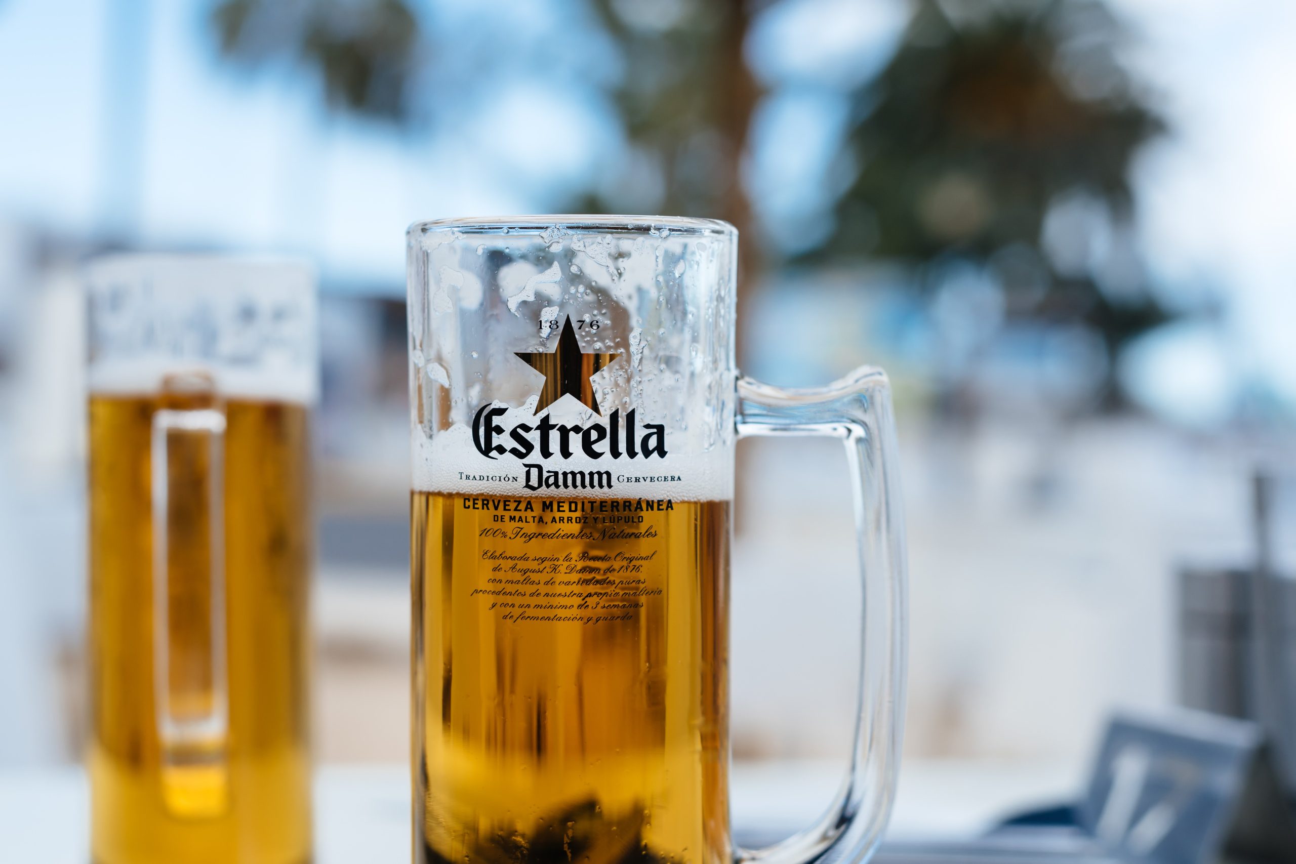 Beer with a pure, bright chromium color like the first rays of morning light scaled - Estrella Damm: Golden Love Song of the Mediterranean Sun