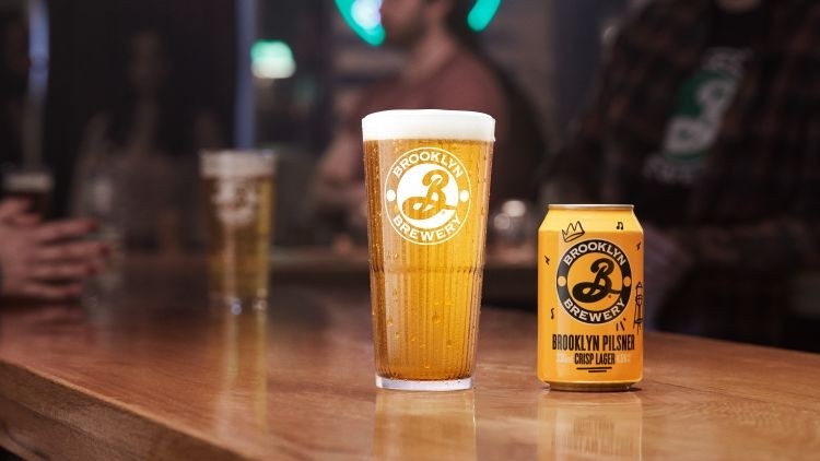 A beer with a bright, golden color like the first rays of summer's rays are gathered - Brooklyn Pilsner: A Golden Sense From the Heart of America