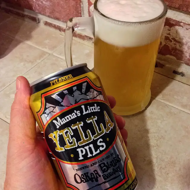 The beer has a bright golden color like the first summer sun on the icy fields of golden sand - Mama's Little Yella Pils: A Golden Gem That Refreshes the Soul