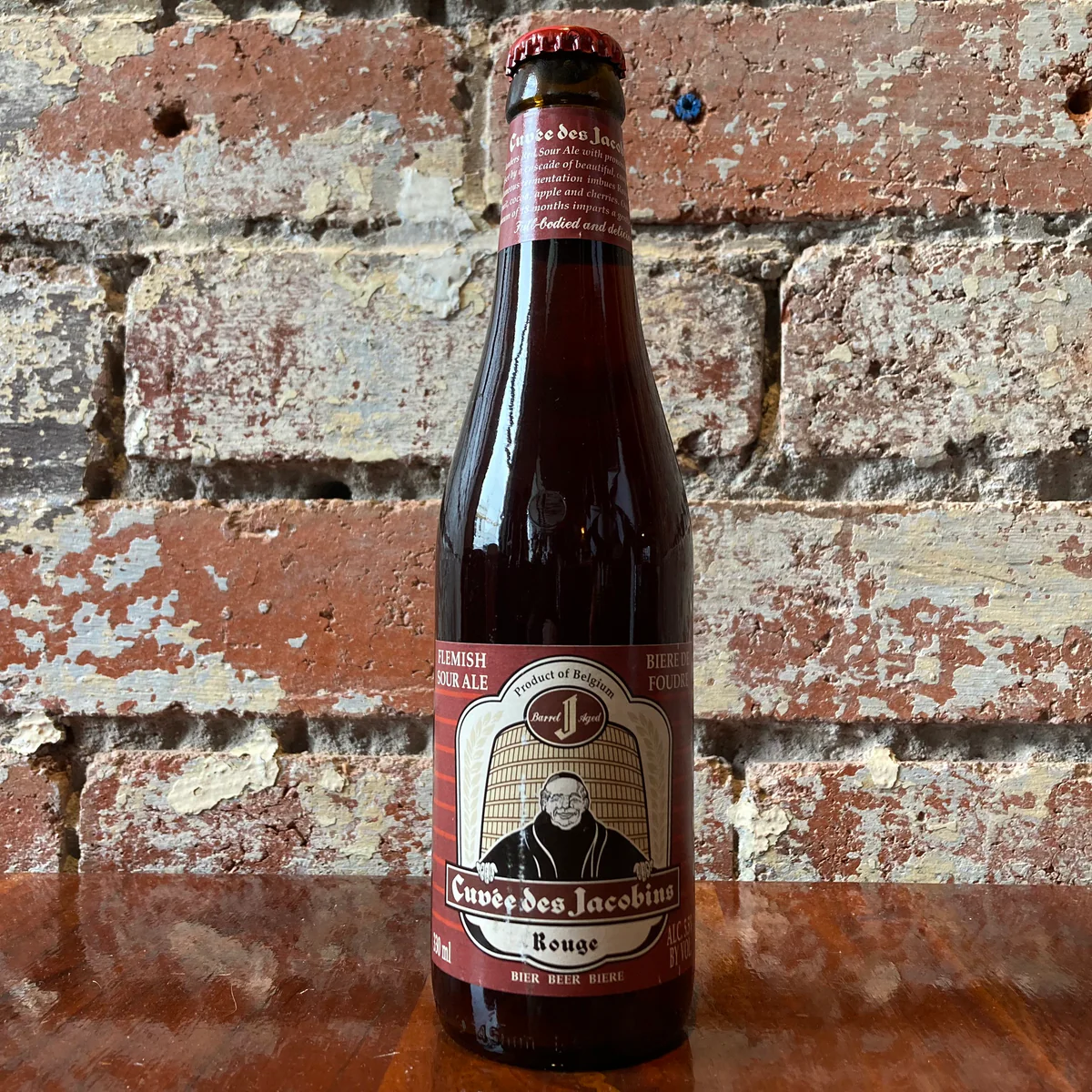 Cuvee Des Jacobins Rouge has a unique design with a human figure in the center - Cuvee Des Jacobins Rouge: The Soul of the Past Echoes