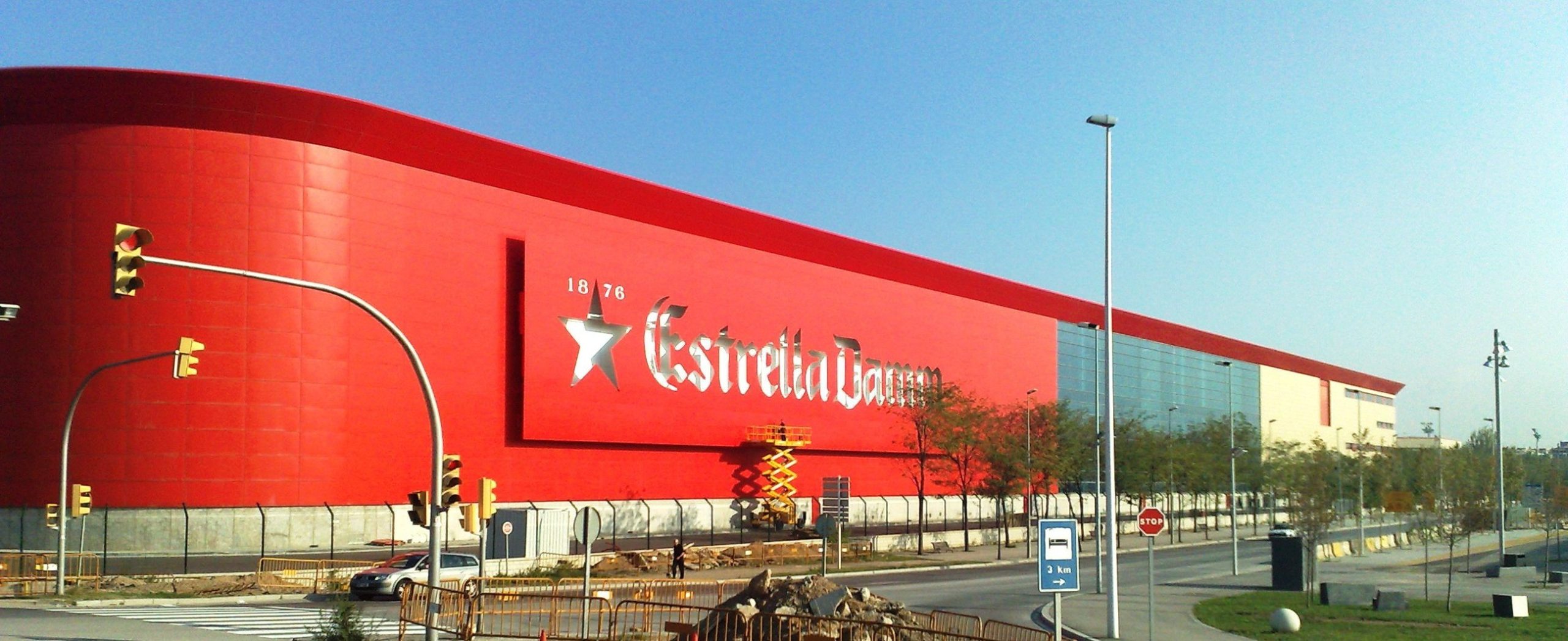 Outstanding image of the exterior of the Damm S. A scaled brewery - Estrella Damm: Golden Love Song of the Mediterranean Sun