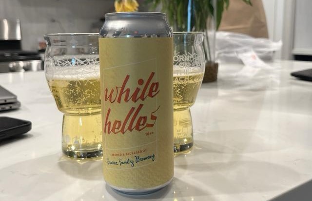 While beer can is designed with a light yellow color but with highlights of the word - While: Clear Golden Moment