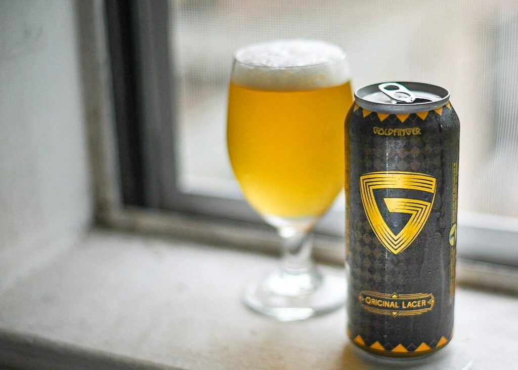 Original Lager has a simple yet impressive design with a dark black color - Goldfinger Original Lager: Golden Light For Awakening Soul