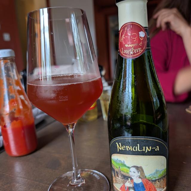 The beer has a rosy red color with a hint of warm golden brown - Nebiulin-a: The Love Story of Little Nebbiolo