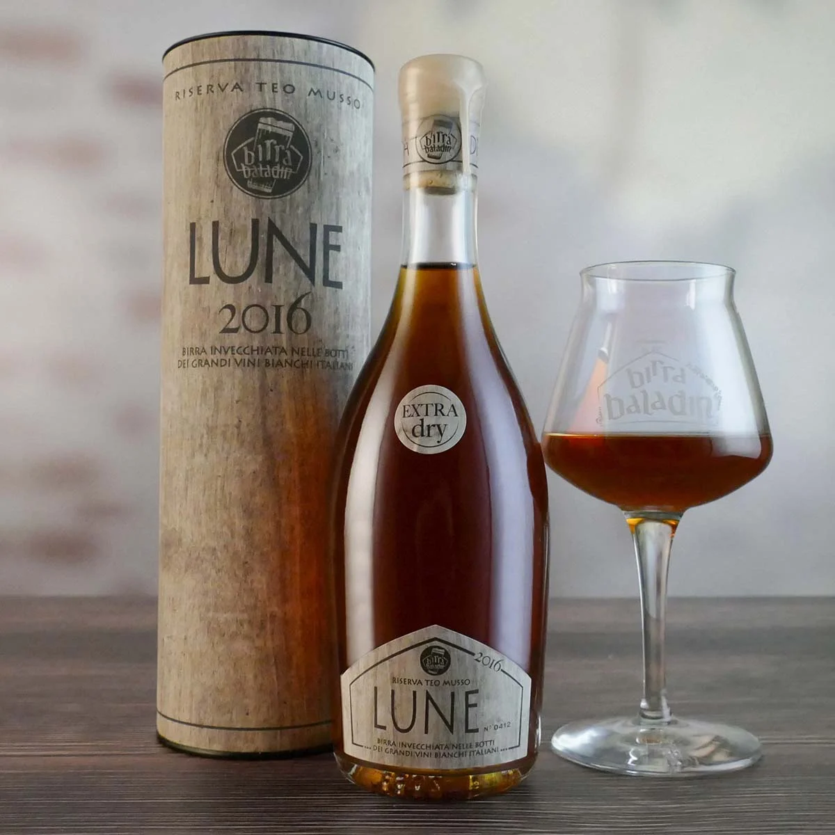 The beer has a dark brown color of the old wood reflecting the amber rays in the dark light - Lune: Where Beer Becomes Legend