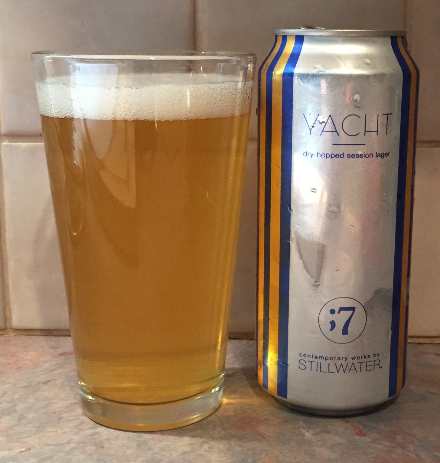 Beer with the color of a single rom-combe shining like a shining metal in a hanging lamp - Yacht: A Manifesto of Simplicity