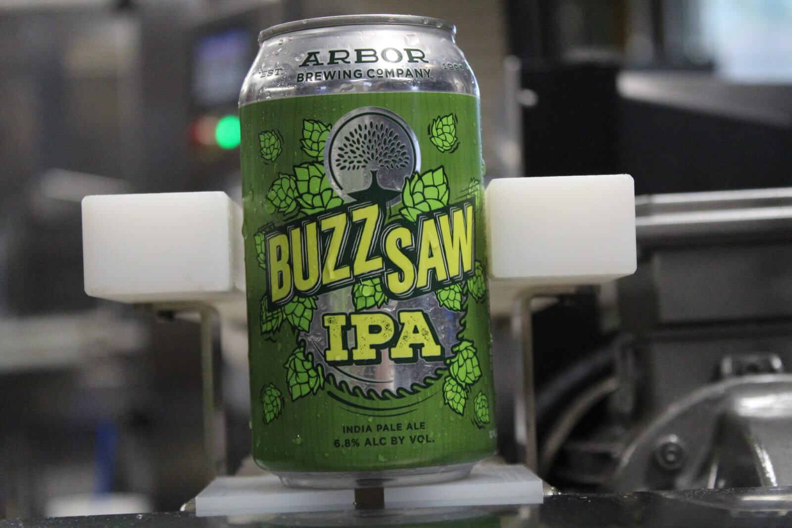 Buzzsaw American IPA has an impressive green bottle design with flowers - Buzzsaw American IPA: A Golden Declaration for Taste Revolution