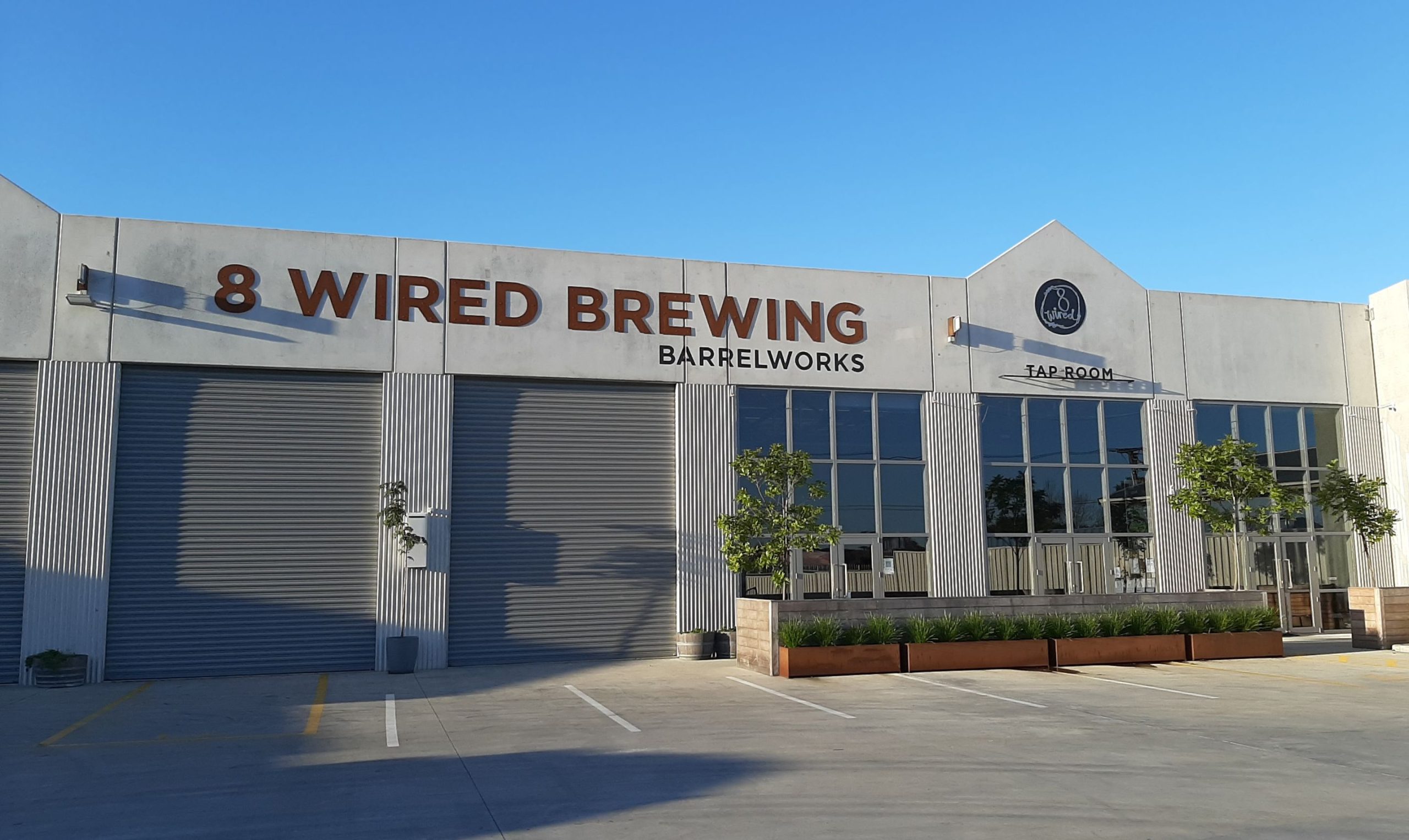Exterior view of 8 Wired Brewing Co. in New Zealand scaled - Flat White Coffee Milk Stout: A Drop of Beer Filled in a Can