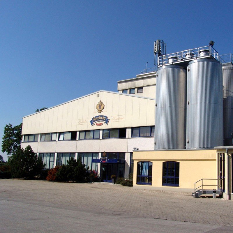 Modern exterior image of the Arcobrau beer factory. Grafliches Brauhaus - Arcobräu Weissbier Hell: A Sweet and Innocent Muse.