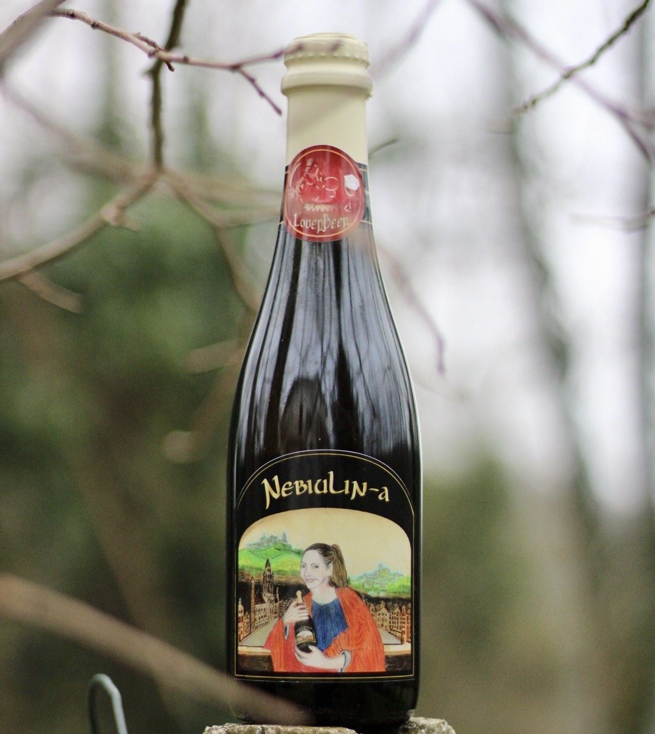 Nebiulin-a has an impressive beer bottle design featuring a unique image of a girl - Nebiulin-a: The Love Story of Little Nebbiolo.
