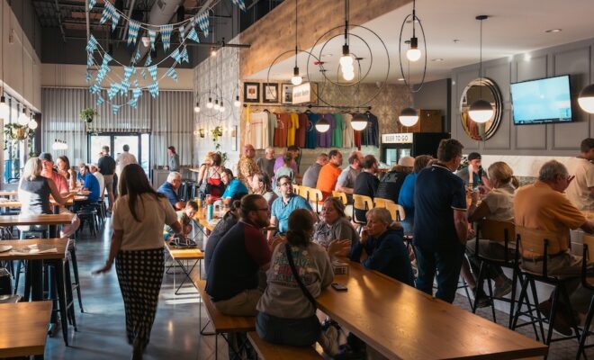 A lively scene inside the tasting area at Roaring Table Brewing Company - Thither They Return: Unveiling the Flavors of History.
