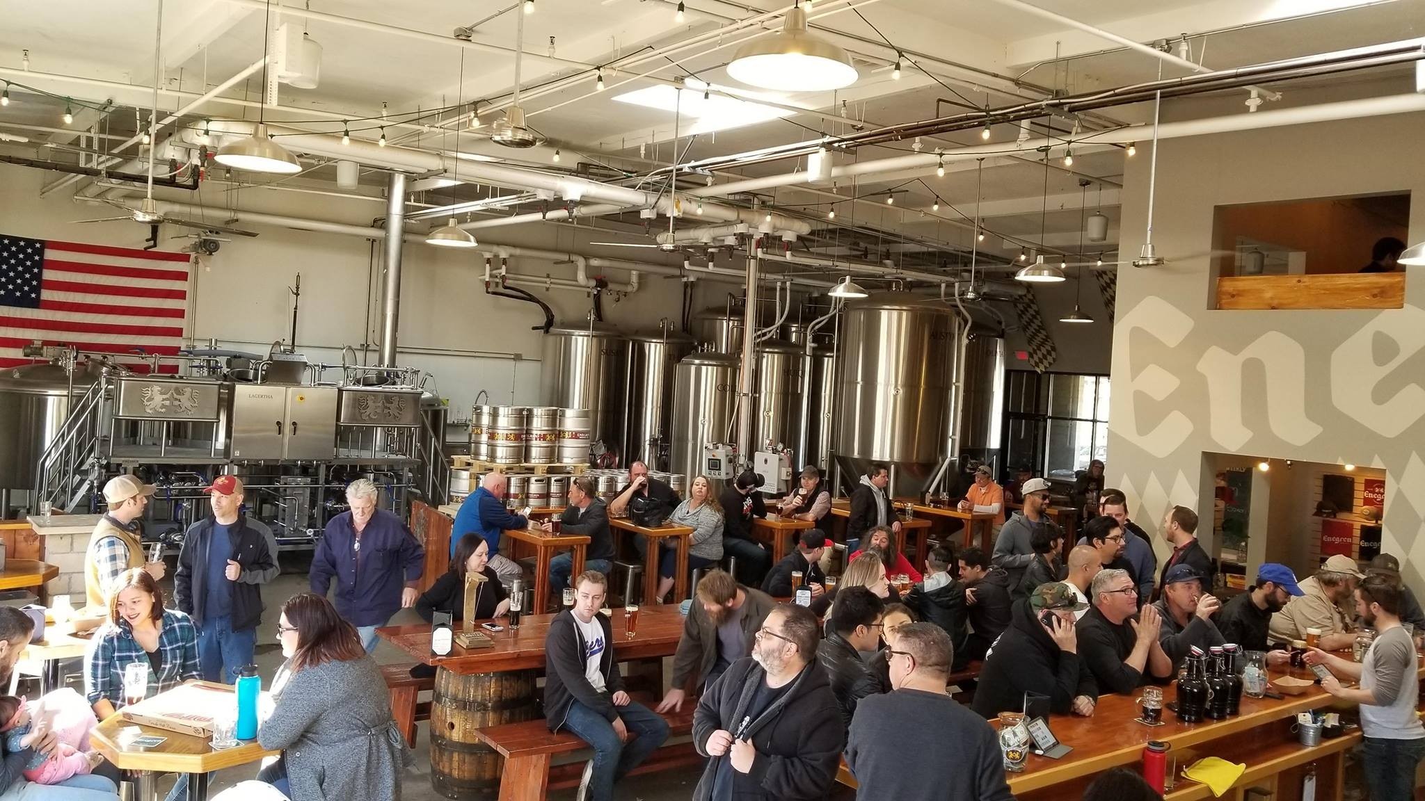 Images of tourists enjoying beer inside the Enegren Brewing Company - L11te factory: The Sour Melody of a Bygone Era Reunion
