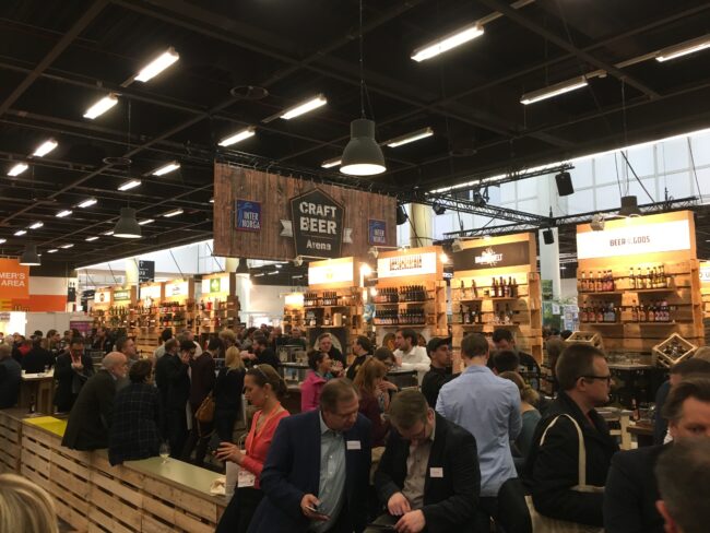 Images of tourists bustling inside the Freigeist Bierkultur - Abraxas brewery: A Declaration of Freedom in a Sip of Beer.