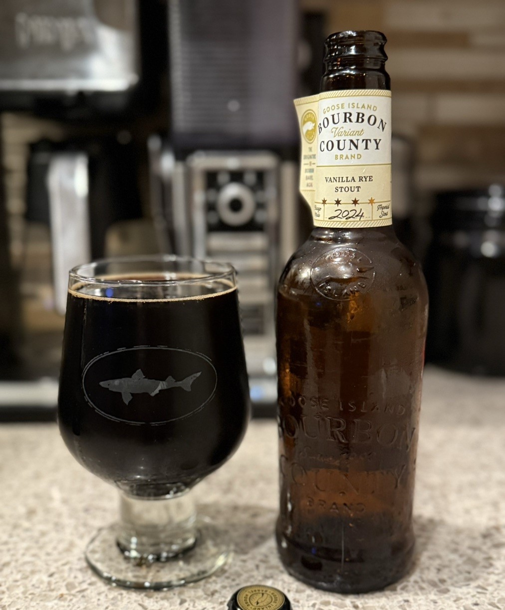 The image shows a glass of beer with a dark, solid color and no light in the glass - Bourbon County Brand Vanilla Rye Stout: A Culinary Adventure