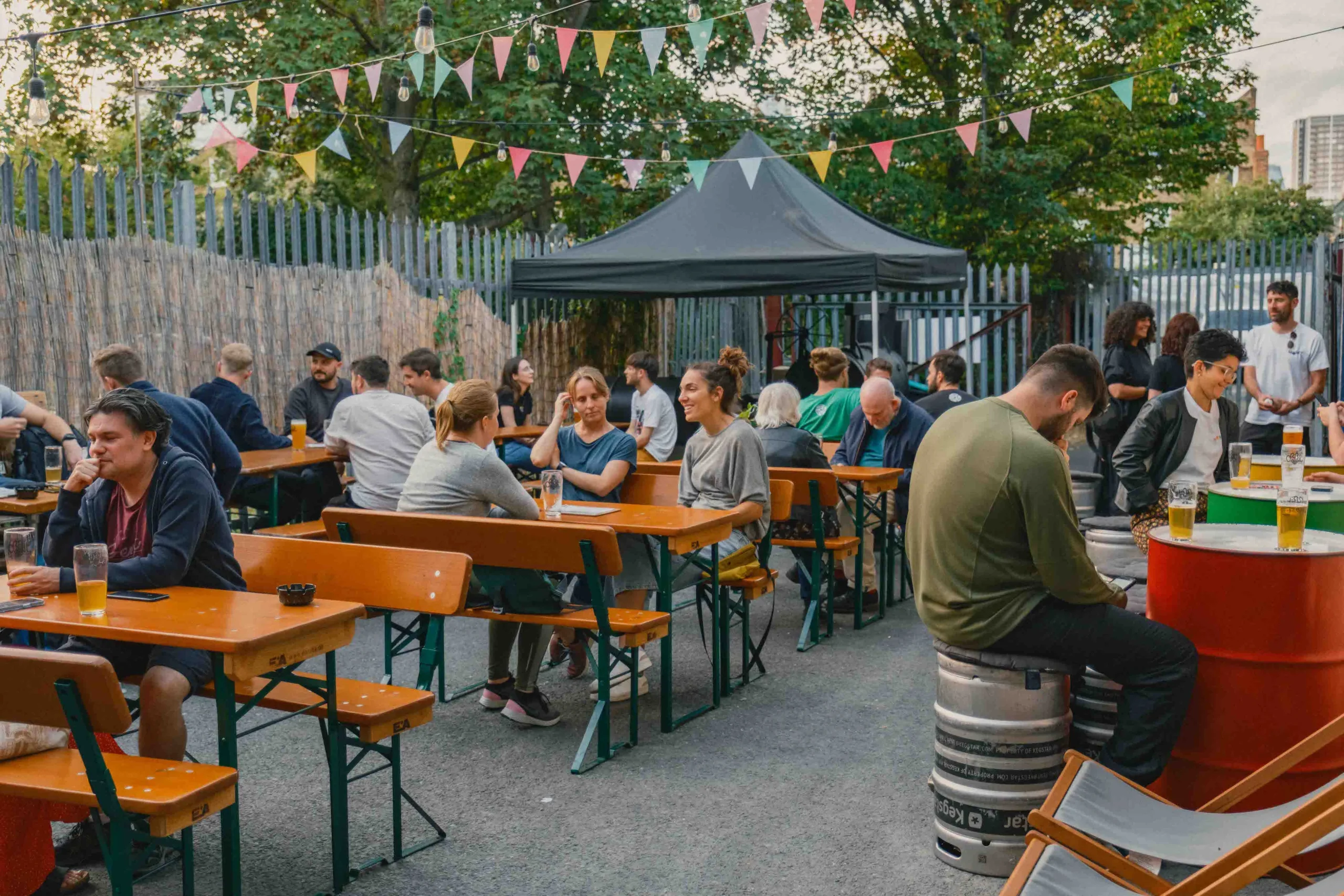 Images of tourists enjoying beer in the grounds of the scaled-down Orbit Beers factory - Tzatziki Sour: A Wind from a Parallel Universe.